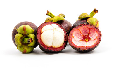 mangosteen fruits placed on a white background.