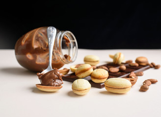 Homemade Russian nuts with condensed milk on a light blue background, wafer napkin. Cut nuts with condensed milk.