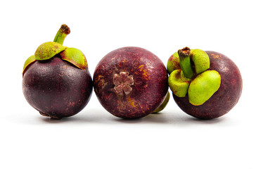 mangosteen fruits placed on a white background.