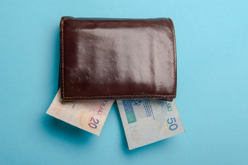 brown leather wallet with money