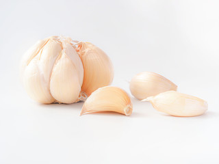 Macro stack garlic cloves on white background, fresh garlic  improves Cholesterol Levels, Which May Lower the Risk of Heart Disease. Health care concept