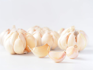Macro stack garlic cloves on white background, fresh garlic  improves Cholesterol Levels, Which May Lower the Risk of Heart Disease. Health care concept