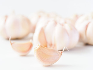 Macro stack garlic cloves on white background, fresh garlic  improves Cholesterol Levels, Which May Lower the Risk of Heart Disease. Health care concept