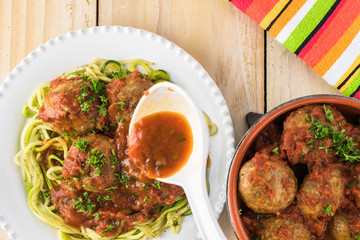 Meatballls in marinara sauce.