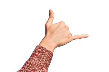 Hand of caucasian young man showing fingers over isolated white background gesturing Hawaiian shaka greeting gesture, telephone and communication symbol