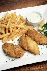 british traditional fish and chips meal on plate