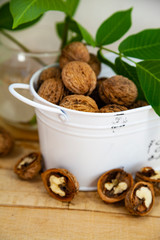 Walnuts and leaves on a  table.