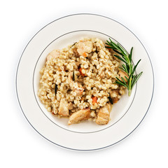 Barley porridge with meat on white plate.