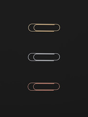 Realistic metal paper clip, Page holder isolated on black background 3d rendering. 3d illustration gold, silver, copper Paperclip icon. Office equipment, office stationery minimal style concept.