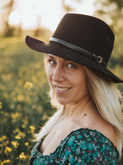 portrait of a woman in a hat, young cowgirl at farm
