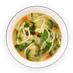 Noodle soup with chicken broth, parsley and carrots.
