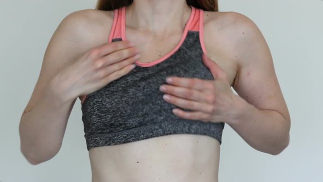 Woman adjust her sport bra