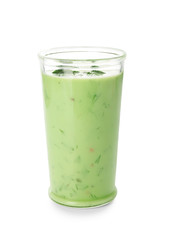 Glass with cold cucumber soup on white background