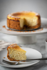 new york style cheesecake on marble background