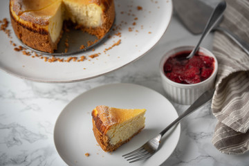 new york style cheesecake on marble background