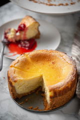 new york style cheesecake on marble background
