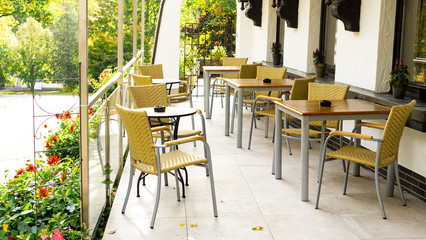 tables and chairs in a restaurant outside area