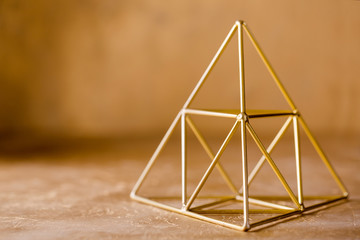 pyramid on a golden background