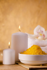 Obraz na płótnie Canvas Yellow sea salt and scented candles