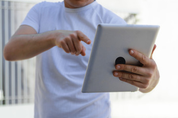 Man pointing a finger at a digital frame