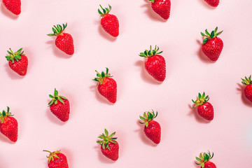 Fresh strawberry pattern on the light pink background. View from above.