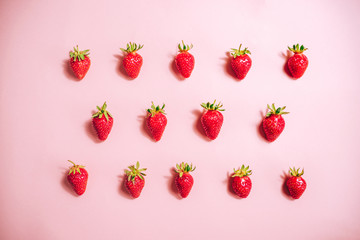 Fresh strawberry pattern on the light pink background. View from above.