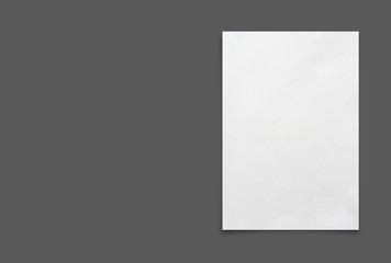 White paper sheet isolated on gray  background.