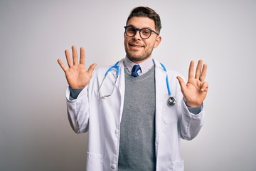 Young doctor man with blue eyes wearing medical coat and stethoscope over isolated background showing and pointing up with fingers number nine while smiling confident and happy.