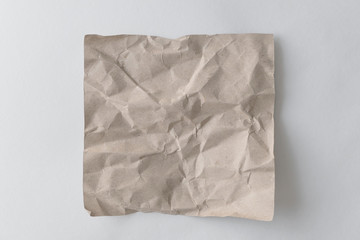 Obraz premium Brown wrinkle recycle paper background. Crumpled brown paper on white background, can use text banners products.