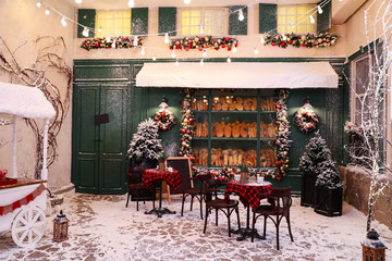 Beautiful outdoor cafe with festive decoration. Christmas celebration