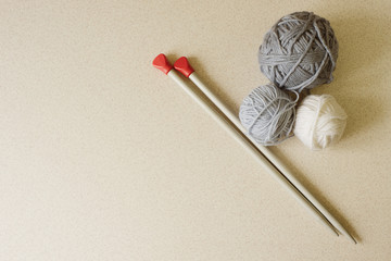 Violet and white yarn ball and knitting needles on white background. simple flat style. Hobby, craft, handmade concept