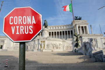 Corona virus sign with Altar of the Fatherland in Rome, Italy. Coronavirus pandemic outbreak concept in north Italy.