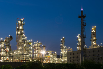 Oil refinery factory in twilight, petrochemical plant