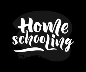 Home schooling hand brush lettering. White text. On black chalkboard As logo of virtual school for children,