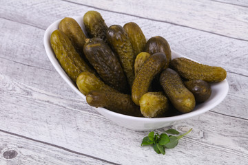 Pickled cucumbers heap in the bowl