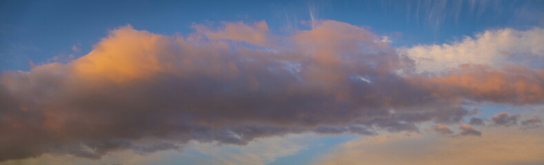 Naklejka na ściany i meble Dramatic sunset sky with colorful clouds