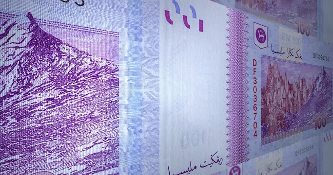 Detailed macro capture of brand new RM 100 with sequential number. Macro shot from the back of Malaysian money with the picture of Mount Kinabalu. 3d effect footage over one hundred Ringgit Malaysia. 