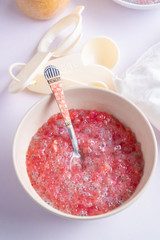 A bowl of sweet red sago in coconut cream.Asian desserts concept