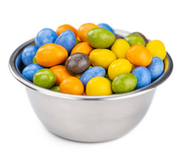 Chocolate coated peanuts isolated on white