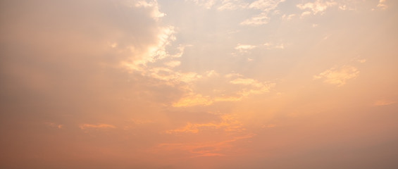 Naklejka na ściany i meble Orange cloud before sunset or sunrise.Cumulus sunset clouds with sun sitting down.panorama cloud scape