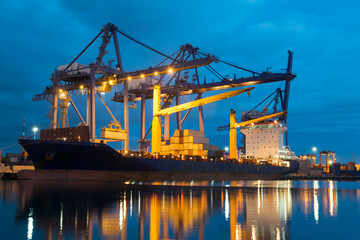 Container ship in asia port while load the job.