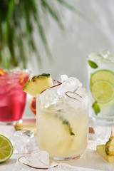 Pina colada cocktail on a grass background. Summer concept.