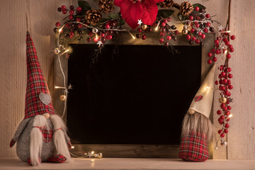 background with blackboard for Christmas texts with lights and gnomes