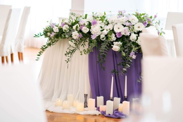 Main table at a wedding reception with beautiful flowers