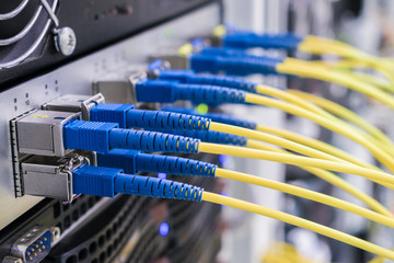 Concept of fast broadband access to the network. Bunch of fiber-optic Internet wires are connected...