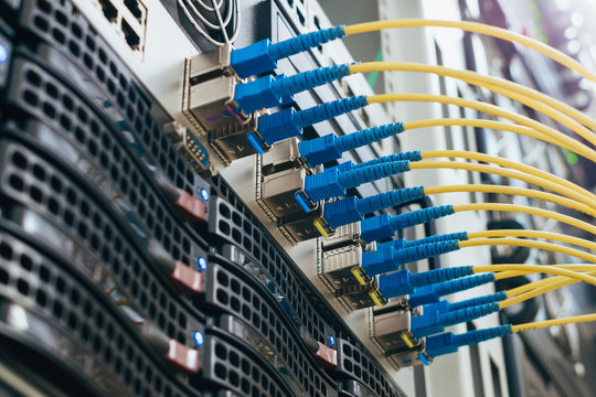 Communication equipment in the server room of the data center. Many fiber patch cords are connected to the interfaces of the Central Internet router. High-speed data transfer in a fiber-optic network