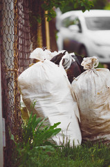 Preparation for garbage collection in a summer cottage, Russia. Close-up. Vertical photograph.