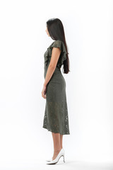 brunette posing in clothes for a catalog on a white background