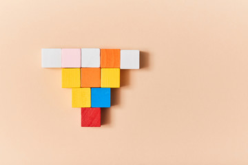 Empty wooden cubes mockup, copy space. Template with colourful blocks for creative design. Isolated on peach background