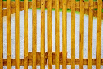 Fence made of wooden planks. Summer evening in the park.  © Danijel Hunjek